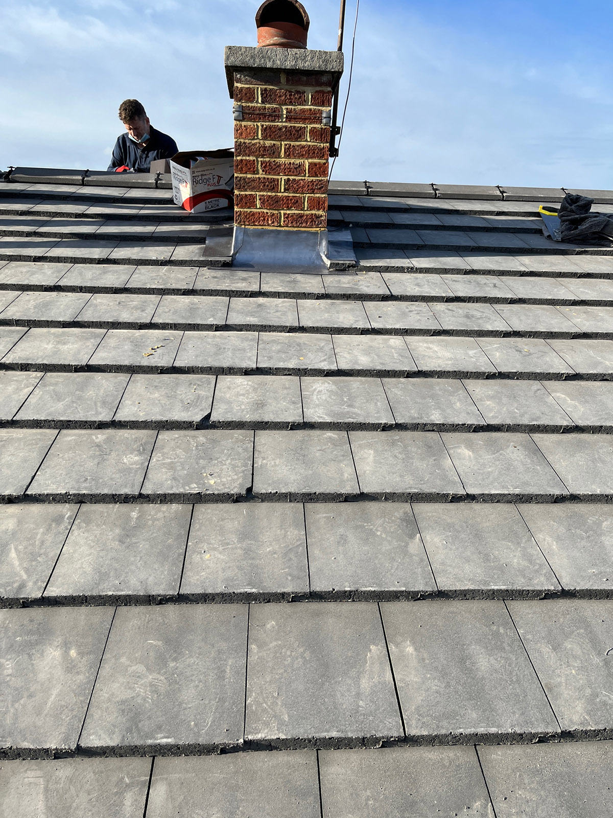 new roof being installed showing tiles and battens